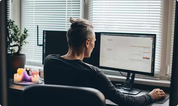 Professional working at dual monitors